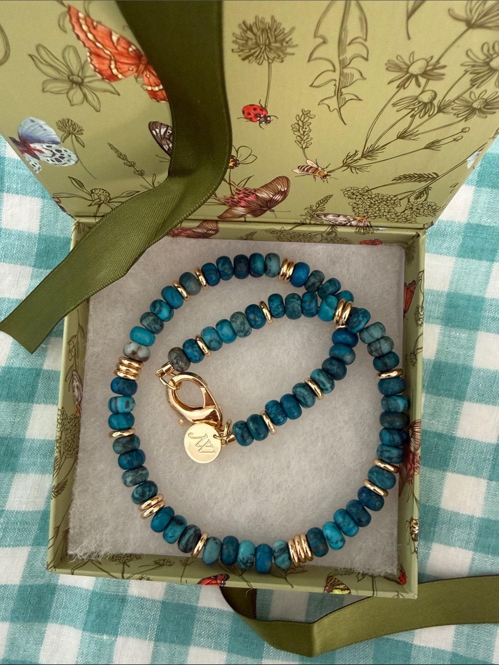 Jane Win Gumdrop Beaded Necklace features turquoise and dark teal color beads